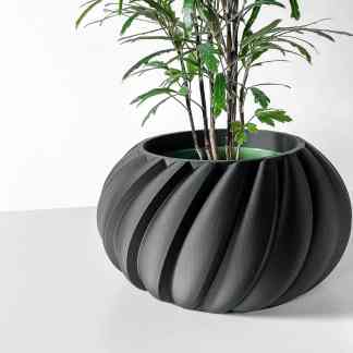 Elegant 3D-printed black container with spiral ridges, perfect for houseplants and office decor.