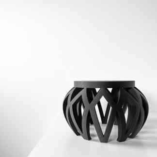 3D printed black stool with complex geometric pattern, perfect for modern home or office decor.