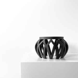 Black 3D-printed decorative stool showcasing intricate design and modern craftsmanship.