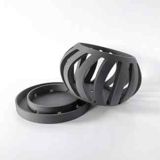 3D printed black circular grid with rings, showcasing innovative 3D printing craftsmanship and design.