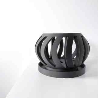 Elegant 3D printed black lamp with a sleek, geometric design for contemporary home decor.