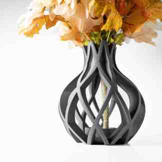 A 3D-printed decorative vase designed with intricate lattice patterns, displayed with artificial autumn flowers for home decor.