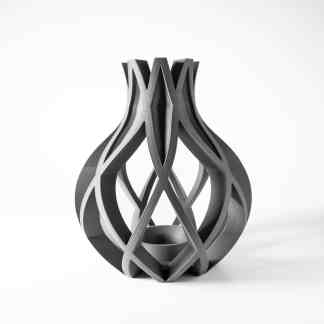 Intricate black and gray 3D printed vase with geometric design.