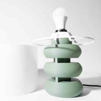 Stylish green and white 3D printed table lamp with innovative geometric design, ideal for modern interiors.
