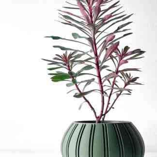 Stylish OVIRE planter with vibrant purple foliage in a sleek green ceramic pot, perfect for home decor.