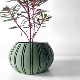 Stylish green 3D printed flower pot with textured stripes, perfect for modern home decor.