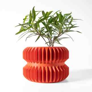 Vibrant orange 3D-printed planter featuring a textured geometric design for contemporary indoor plant decoration.