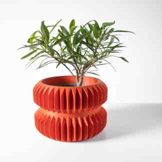 Stylish 3D-printed terracotta planter with intricate geometric texture, ideal for showcasing indoor plants.