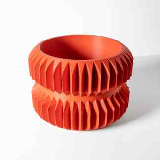 Vibrant orange 3D-printed gear with detailed teeth for engineering applications.