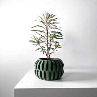 3D-printed decorative plant pot with unique ribbed texture, perfect for modern interior accents.