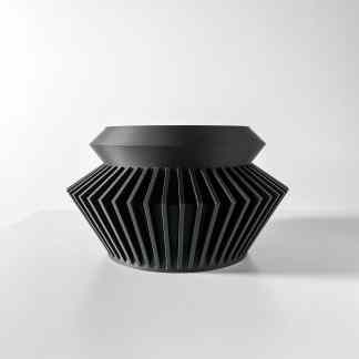 Sleek black 3D printed geometric art piece showcasing intricate design and craftsmanship.