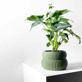 Green textured planter for indoor plants, stylish and modern home decor accessory.