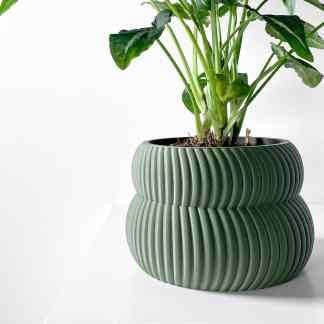 A stylish indoor plant in a unique, ribbed ceramic pot, ideal for modern home or office decor, emphasizing eco-friendly, high-quality design.