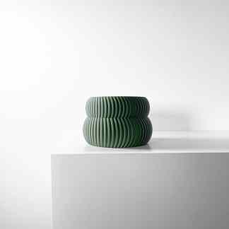 Elegant green 3D printed vase with textured striped design, showcasing innovative 3D printing technology.