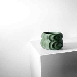 Sleek 3D printed green ceramic bowl illustrating modern design by AM Square 3D.