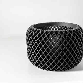 Black 3D-printed decorative vase with intricate lattice design, showcasing innovative manufacturing techniques.