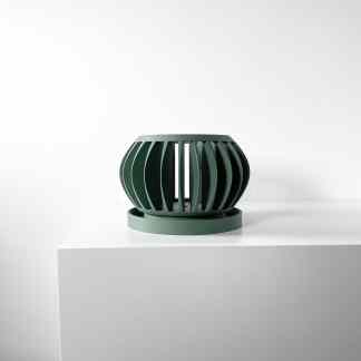 Sleek green 3D-printed lantern with open, curved design, perfect for modern interior decor.