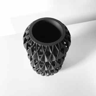 Intricate black 3D-printed lattice pattern created with additive manufacturing technology.