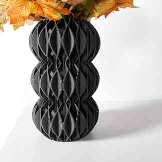 High-quality 3D printed black vase with intricate geometric design, perfect for modern interiors.