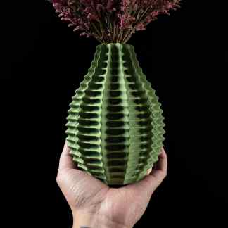 Elegant pink floral arrangement in a textured green 3D-printed vase. Perfect for contemporary home decor.