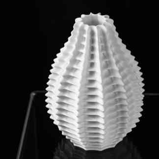 Detailed black and white image of a 3D-printed lamp with unique layered pattern.