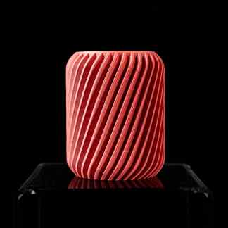 Bold pink 3D printed sculpture with textured spiral details.