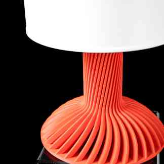High-quality 3D-printed sculpture with vibrant orange color and intricate design.