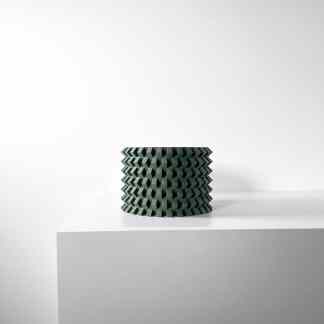 Unique 3D-printed RILVO planter with intricate geometric pattern in dark green on a plain white background.
