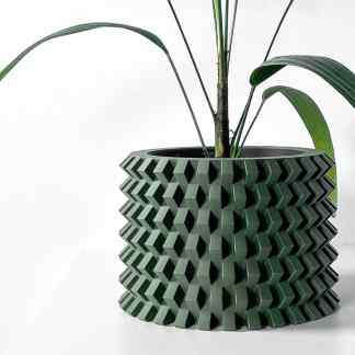 3D printed green geometric flower pot with plant for modern home decor.