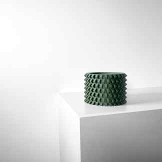Geometric 3D printed vase on white pedestal for contemporary interior design.