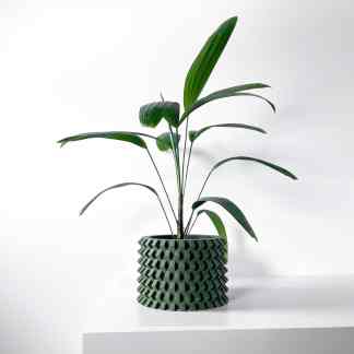 A detailed view of a 3D-printed decorative plant pot with complex geometric patterns made using cutting-edge 3D printing techniques.