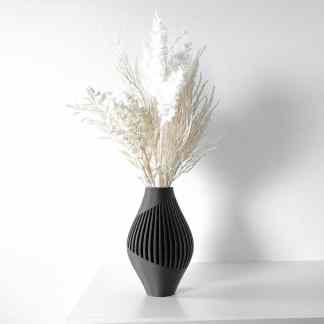 Stylish black vase with unique slatted details for contemporary home décor.