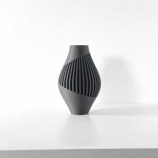 Black ceramic vase with stylish striped pattern, perfect for contemporary interior design.