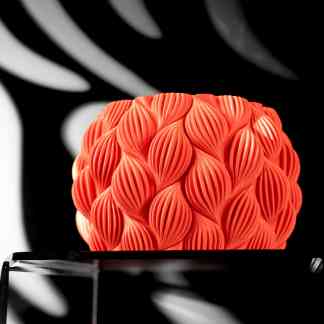Highly detailed 3D printed sculpture with intricate petal-like patterns in vivid orange.