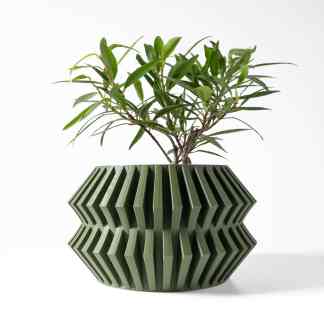 Vivid green plant in a unique 3D-printed geometric ceramic planter, ideal for modern indoor decor.