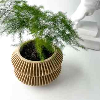 Close-up of lush green potted plant in a stylish beige ribbed ceramic planter.