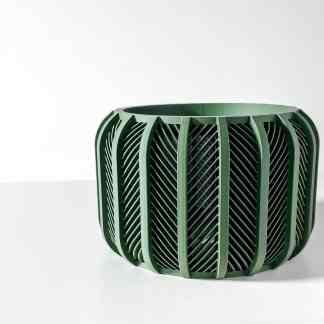 3D printed green geometric vase with complex patterns, perfect for home decor and innovative design.