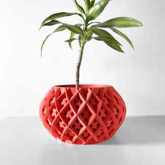 Colorful 3D-printed ROKIO planter in coral with detailed lattice design, perfect for home aesthetics.
