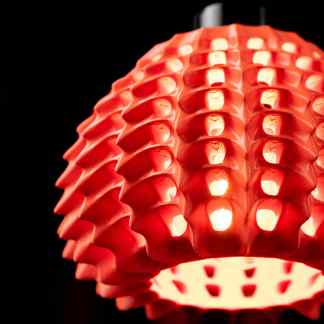High-quality 3D-printed red lighting fixture with intricate design, ideal for modern interior decor.