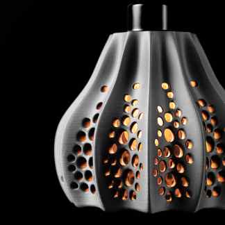 Elegant black and silver jewelry pendant with detailed perforations, ideal for stylish accessories.