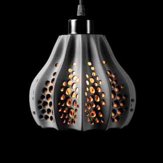 Sleek metallic pendant light with perforated design, giving off a warm glow, ideal for modern home or office lighting.
