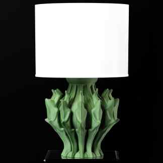 Unique shade lamp with green sculptural base and white lampshade for stylish interior lighting.