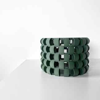 3D printed green circular sculpture, innovative design, modern 3D printing art and decor.