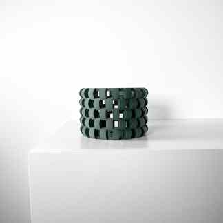 Elegant green 3D printed vase featuring interwoven geometric patterns.