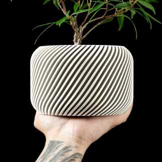 3D printed plant pot with unique striped design, demonstrating advanced 3D printing capabilities by AM Square 3D.
