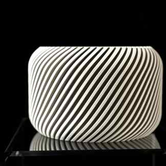 Highly detailed 3D-printed ceramic vase with sleek black and white striped design, perfect for contemporary decor.