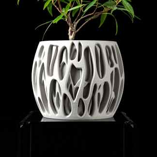 Modern 3D-printed plant pot with intricate geometric patterns, highlighting advanced additive manufacturing techniques.