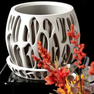 Elegant 3D printed ceramic vase showcasing intricate organic patterns and modern craftsmanship.