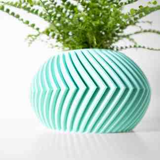 Elegant 3D printed vase with geometric chevron pattern, perfect for modern home decor.