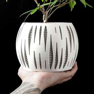 3D printed modern plant pot with intricate geometric design, ideal for stylish home decor.